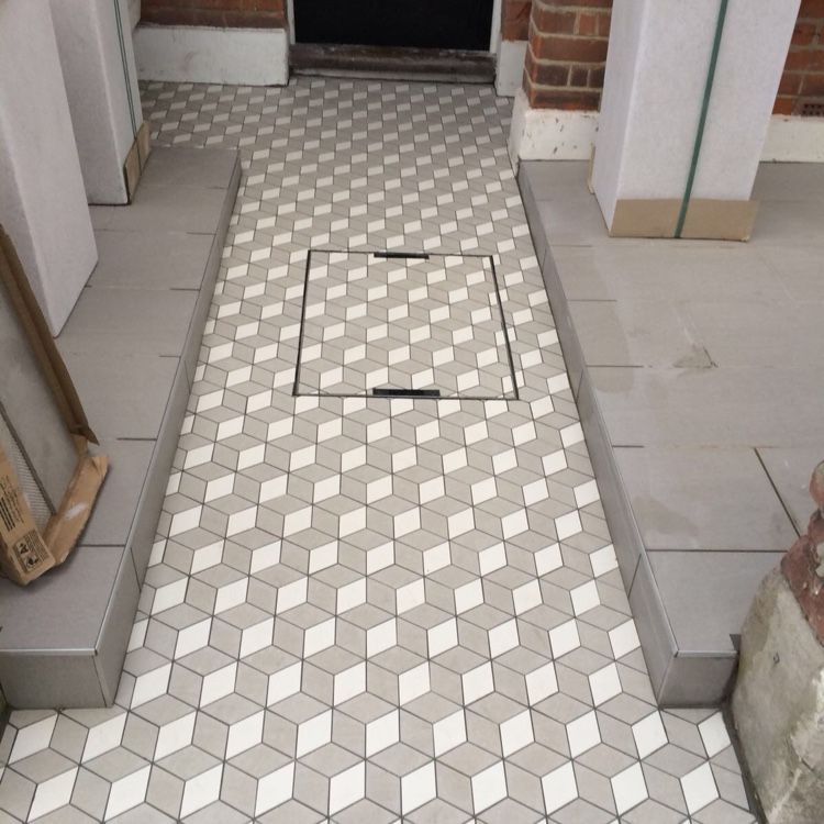 3D diamond pattern Victorian tiles being installed in front path
