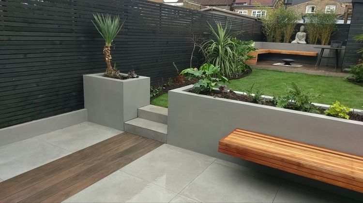 Contemporary courtyard with charred timber fencing, render planters and cedar bench