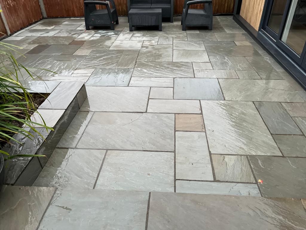 Large natural sandstone paving with outdoor furniture