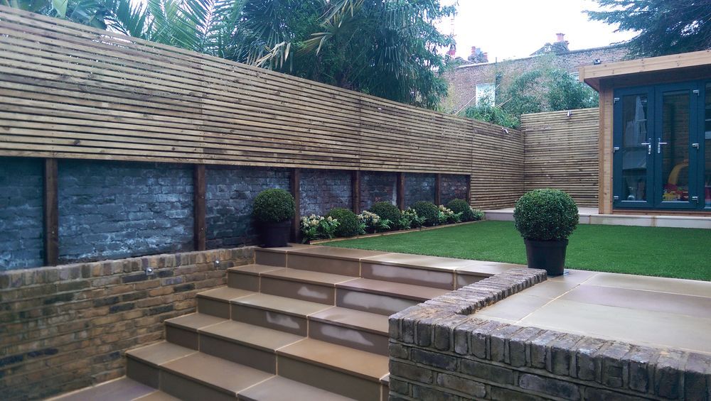 Stone garden stairs with LED step lighting and brick retaining walls
